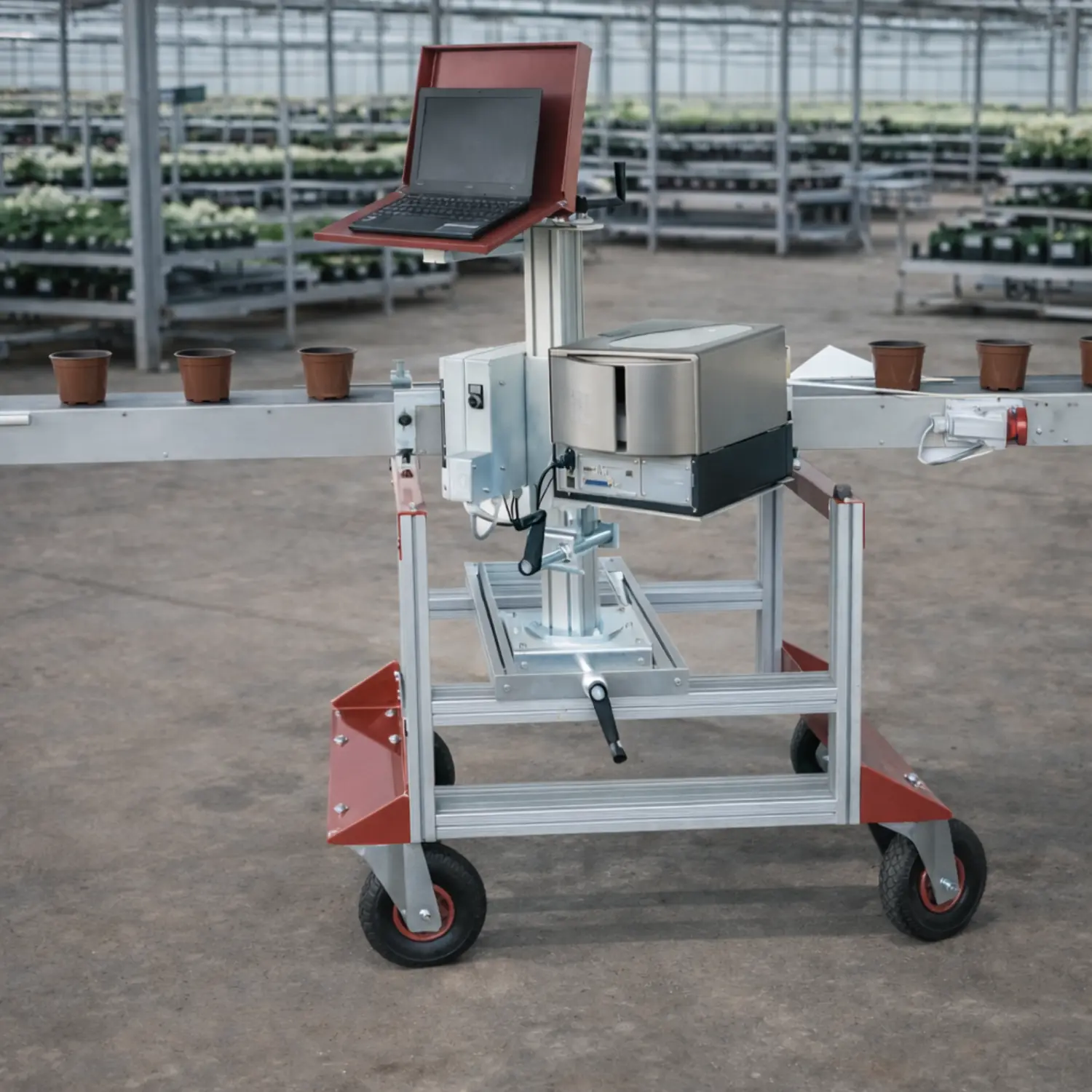 Pot labeling machine installed in an industrial greenhouse with conveyor system